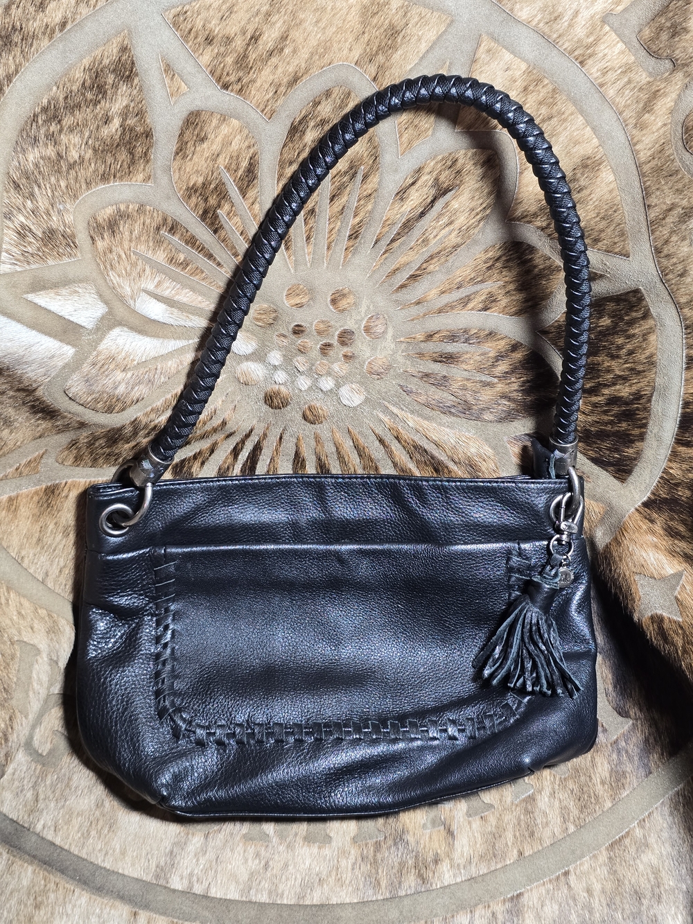 The Sak Black Leather Shoulder Bag with Tassel Accent